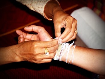 Person Putting White Bracelet