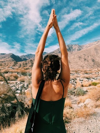 Person Raising Hands Upward