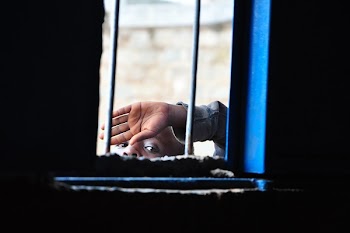 Person Raising His Left Hand