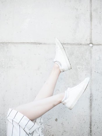 person raising its foots near wall