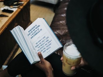 person reading blue book