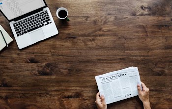 person reading newspaper