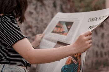 Person Reading Newspaper