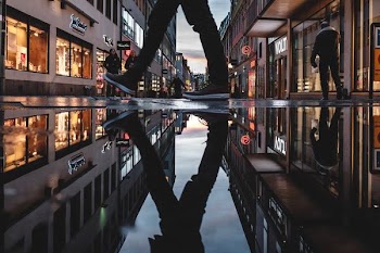 person reflecting on ground water