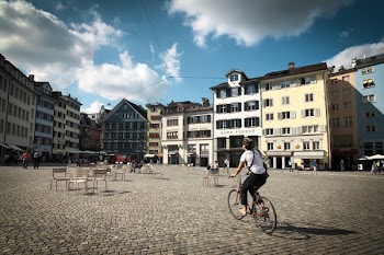 Person Rides on Bicycle