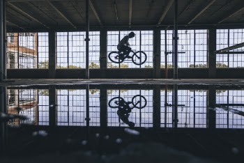 Person Riding A Bicycle Inside the Building