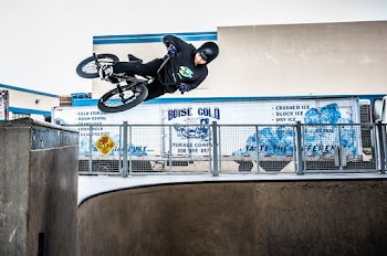 Person Riding Bicycle Doing Stunt on Ramp