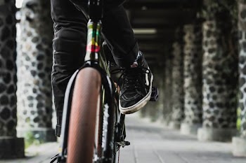 person riding bicycle on hallway