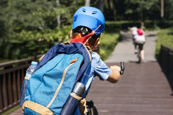 Person Riding Bicycle Wearing Backpack