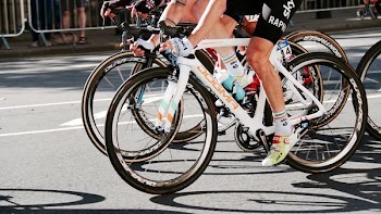 person riding bicycles on street