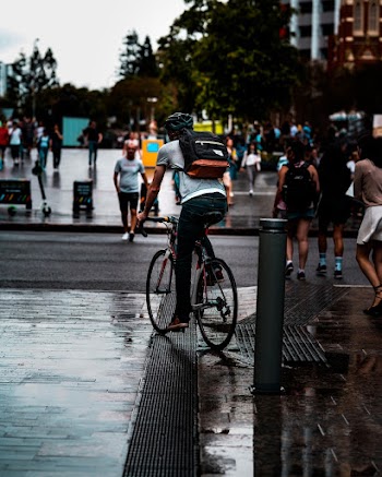 Person Riding Bike on Road