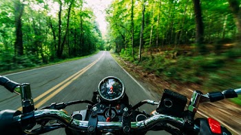 Person Riding Black and Gray Motorcycle on Road