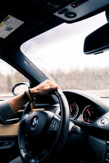 person riding BMW car