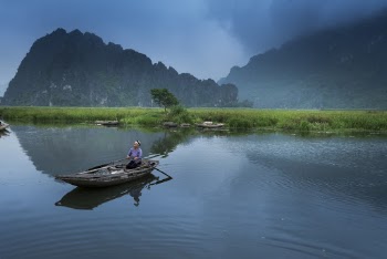 Person Riding Boat 
