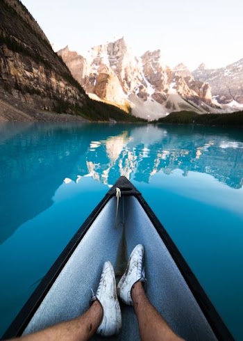 person riding boat at Banff National Park