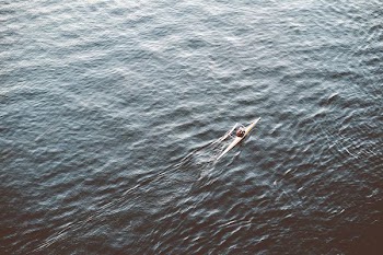 person riding boat during day time