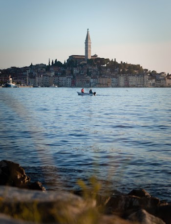 Person Riding Boat on the Body of Water Photograph