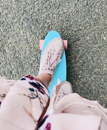 Person Riding Green Penny Board