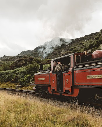 Person Riding in Red Train
