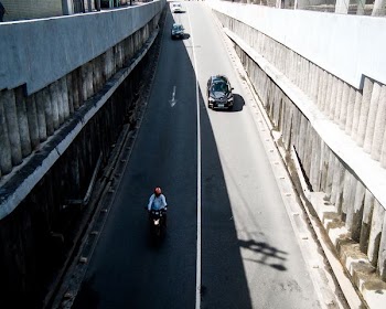 person riding motorcycle in street