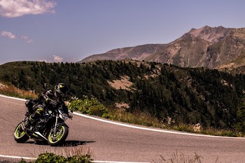 Person Riding Motorcycle on Road