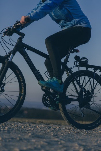 Person Riding on Black Mountain Bike during Night Time