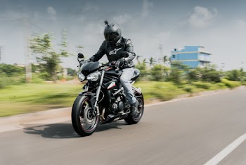 Person Riding on Motorcycle