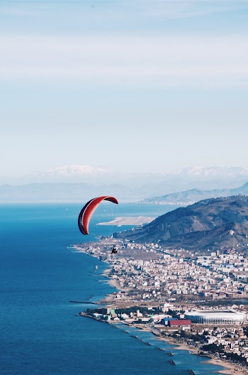 Person Riding on Parachute