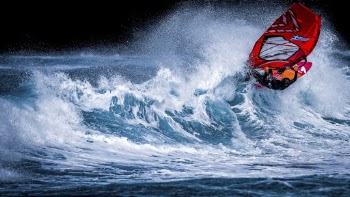 Person Riding on Surfboard