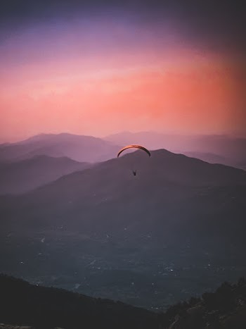 Person Riding Parachute