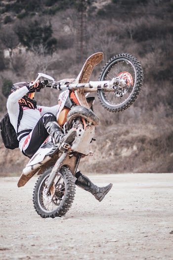 Person Riding Yellow Dirt Bike