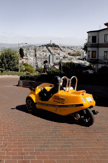 Person Riding Yellow Vehicle