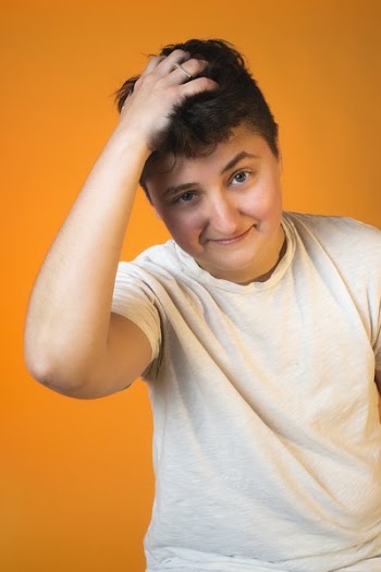 Person Ruffling Their Hair Portrait