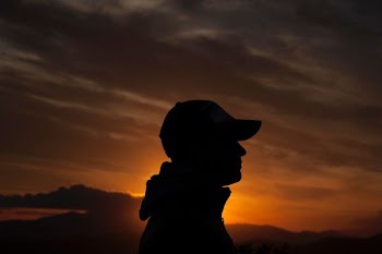 person's silhouette during golden hour