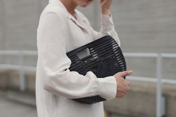 person's white collared long-sleeved top