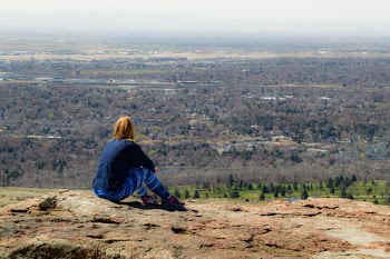 Person Seating on Brown Ground