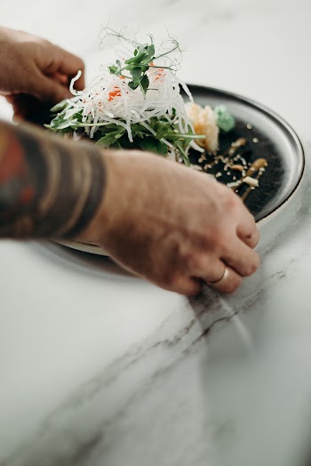 Person Serving Bowl of Food