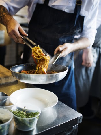 Person Serving Pasta