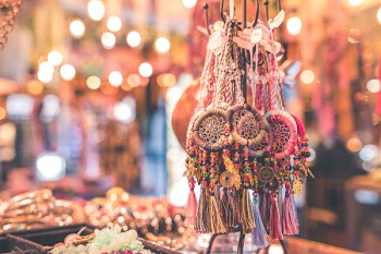 Person Showing Assorted Dream Catcher Keychain Lot in Tilt Shift Photography 