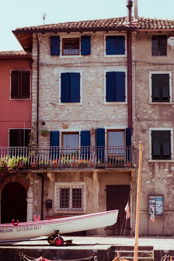 Person Showing Brown Concrete House