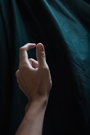 Person Showing Left Thumb