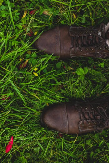 Person Showing Pair of Brown Low-top Shoes