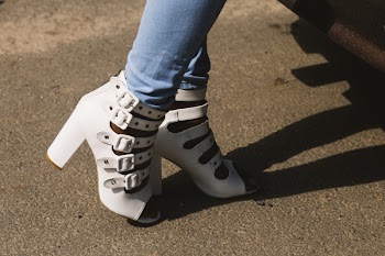 Person Showing Pair of White Peep-toe Chunky Heel Sandals