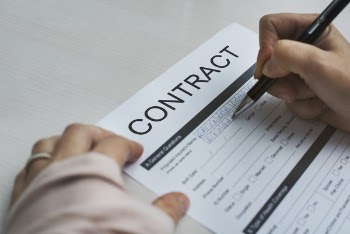 Person Signing Contract Paper