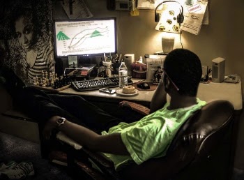 Person Sits in Front of Computer