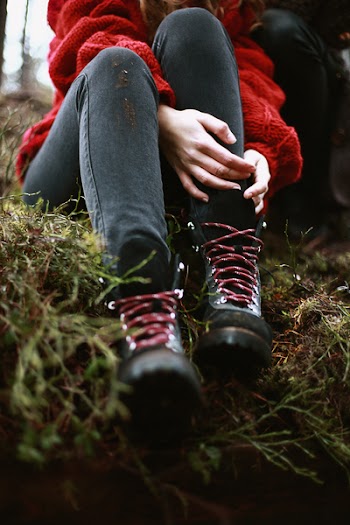 Person Sits on Green Grass