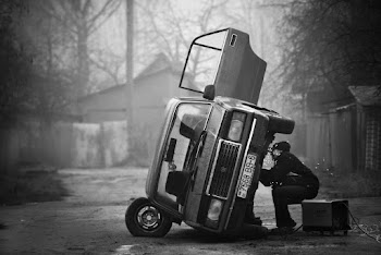 Person Sitting Beside Car