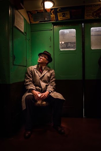 person sitting inside train