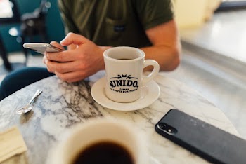 Person Sitting Near Table