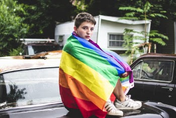 Person Sitting On A Car